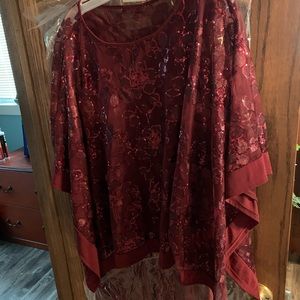 Wine colored two piece full length sleeveless gown with slit up the side.